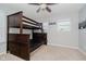 Cozy bedroom with a bunk bed, carpet, and a window view that maximizes space and comfort at 20846 Winding Lake E Dr, Noblesville, IN 46062