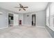 Spacious bedroom with cozy carpet, a ceiling fan, and multiple doors leading to other rooms at 20846 Winding Lake E Dr, Noblesville, IN 46062