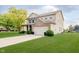 Side view of a lovely 2 story home with a well-maintained lawn at 20846 Winding Lake E Dr, Noblesville, IN 46062