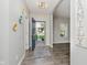 Inviting foyer with gray walls, wood flooring, and an open doorway at 20846 Winding Lake E Dr, Noblesville, IN 46062