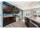Well-lit kitchen with stainless steel appliances, a kitchen island, and ample counter space at 20846 Winding Lake E Dr, Noblesville, IN 46062