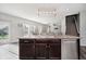Beautiful kitchen island with seating and sink in this modern home with a stainless steel dishwasher at 20846 Winding Lake E Dr, Noblesville, IN 46062