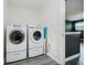 Functional laundry area includes a front load washer and dryer on pedestals at 20846 Winding Lake E Dr, Noblesville, IN 46062