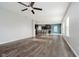 Open-concept living space with wood-look floors flowing into the kitchen and a large center island at 20846 Winding Lake E Dr, Noblesville, IN 46062