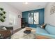 Comfortable living room with modern decor, stylish seating, and bright accent wall at 20846 Winding Lake E Dr, Noblesville, IN 46062