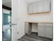Practical office space with built-in gray cabinets and butcher block countertop desk at 20846 Winding Lake E Dr, Noblesville, IN 46062