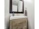 Bathroom vanity with rustic wood cabinetry, a white countertop, and a modern faucet at 20846 Winding Lake E Dr, Noblesville, IN 46062