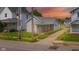 Charming single-story home featuring a welcoming front porch and well-maintained lawn at sunset at 2111 Central Ave, Anderson, IN 46016