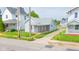 Cozy single-story home with a quaint covered porch perfect for enjoying the outdoors and grassy front lawn at 2111 Central Ave, Anderson, IN 46016
