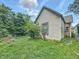 The exterior of the house with green lawn, window, fence, and tree at 2426 Lasalle St, Indianapolis, IN 46218