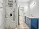 Bright bathroom featuring a stylish vanity with marble countertops, modern fixtures, and a glass-enclosed shower at 2426 Lasalle St, Indianapolis, IN 46218