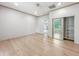 Light-filled bedroom featuring wood floors, a window, and an inviting doorway, creating a cozy and relaxing atmosphere at 2426 Lasalle St, Indianapolis, IN 46218