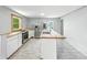 Renovated kitchen boasts stainless steel appliances, butcher block counters, and a kitchen island at 2426 Lasalle St, Indianapolis, IN 46218
