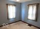 Bedroom featuring two windows and patterned carpet at 249 Ohio St, Franklin, IN 46131