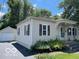 A quaint single-story home with a detached garage and a neatly kept lawn at 249 Ohio St, Franklin, IN 46131