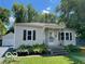 A quaint single-story home with a detached garage and a neatly kept lawn at 249 Ohio St, Franklin, IN 46131