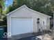 View of the detached garage and an access gate to the backyard at 249 Ohio St, Franklin, IN 46131