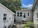 Back of home showing garage, sunroom and access to the backyard at 249 Ohio St, Franklin, IN 46131