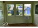 Sunroom featuring lots of windows and an AC unit at 249 Ohio St, Franklin, IN 46131