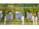 An aerial view captures the landscaped backyard with a patio and lush greenery, showcasing the property's outdoor appeal at 2566 Maple Creek Dr, Westfield, IN 46074
