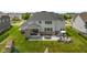 Expansive backyard featuring a patio with seating, dining and outdoor fire pit, perfect for entertaining and relaxing at 2566 Maple Creek Dr, Westfield, IN 46074