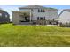 A well-manicured backyard with a patio and covered porch, offering the perfect space for relaxation and outdoor enjoyment at 2566 Maple Creek Dr, Westfield, IN 46074