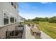 A spacious backyard features an outdoor seating area with a firepit, perfect for enjoying the outdoors at 2566 Maple Creek Dr, Westfield, IN 46074
