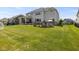 Expansive backyard with manicured lawn, features a patio, perfect for outdoor living and entertaining at 2566 Maple Creek Dr, Westfield, IN 46074