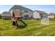 A spacious backyard features a playset and patio, making it perfect for families and outdoor activities at 2566 Maple Creek Dr, Westfield, IN 46074