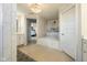 An ensuite bathroom featuring an elegant tub, vanity, and shower with stunning white tile at 2566 Maple Creek Dr, Westfield, IN 46074