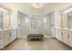 A luxurious bathroom featuring -and- shower stalls, marble tile, and a center bench at 2566 Maple Creek Dr, Westfield, IN 46074