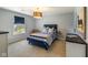 This bedroom features blue accents, including a blue bed frame and window treatments at 2566 Maple Creek Dr, Westfield, IN 46074