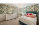 Charming bedroom featuring floral wallpaper, elegant chandelier, and comfortable furnishings at 2566 Maple Creek Dr, Westfield, IN 46074