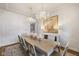 Formal dining room featuring designer chandeliers, neutral tones, and a decorative buffet at 2566 Maple Creek Dr, Westfield, IN 46074
