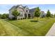 Lovely two-story home with manicured lawn and a classic architectural design at 2566 Maple Creek Dr, Westfield, IN 46074