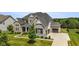 Elegant home with a three-car garage, spacious driveway, and well-kept lawn at 2566 Maple Creek Dr, Westfield, IN 46074