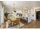 Bright kitchen and dining area with a large island, stainless steel appliances, and pendant lighting at 2566 Maple Creek Dr, Westfield, IN 46074