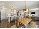 Open concept kitchen, dining, and living area boasts stainless appliances and an inviting atmosphere at 2566 Maple Creek Dr, Westfield, IN 46074