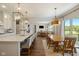 Bright, open kitchen with marble countertops, stainless appliances, and seamless flow to the dining area at 2566 Maple Creek Dr, Westfield, IN 46074