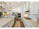 Modern kitchen with white cabinets, a marble island, stainless steel appliances, and ample counter space at 2566 Maple Creek Dr, Westfield, IN 46074