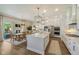 Spacious kitchen with a large island, stainless steel appliances, and an adjacent dining area at 2566 Maple Creek Dr, Westfield, IN 46074