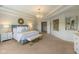 A relaxing main bedroom featuring a chandelier, gold accents, and neutral colors at 2566 Maple Creek Dr, Westfield, IN 46074