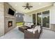 Covered patio with a brick fireplace and comfortable seating, perfect for outdoor relaxation and entertaining at 2566 Maple Creek Dr, Westfield, IN 46074