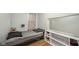 This bedroom features a gray bed, shelves, gray walls, and a plush teddy bear at 2627 Chase St, Anderson, IN 46016