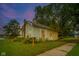 Charming home showcasing lush greenery and a well-maintained front yard at 2627 Chase St, Anderson, IN 46016
