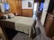 Bedroom with bed, nightstand, and neutral walls at 2731 Delaware St, Anderson, IN 46016