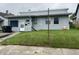 Charming single-story home featuring a cozy front yard, light blue siding and white trim at 2731 Delaware St, Anderson, IN 46016