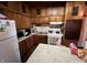 A functional kitchen with classic cabinets and appliances, perfect for home cooking and meal prep at 2731 Delaware St, Anderson, IN 46016