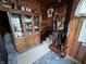 A view into the living room, featuring wood walls, carpet, and staircase to the upper level at 2731 Delaware St, Anderson, IN 46016
