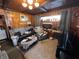 Comfortable living room with a fireplace, couch, and natural light from the window at 2731 Delaware St, Anderson, IN 46016